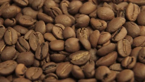 Roasted coffee bean. Fragrant coffee beans scrolls slowly around the camera Stock Footage 149470599