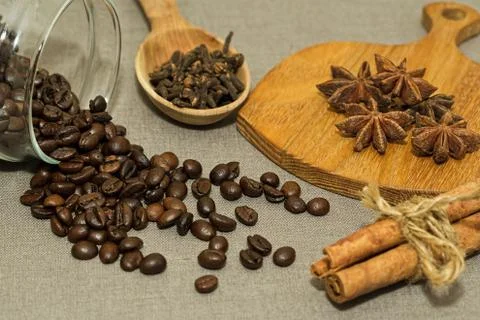 Roasted coffee beans and different spices Stock Photos