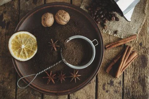Roasted coffee beans and ground coffee in the plate Stock Photos