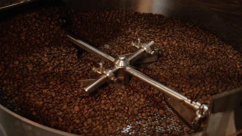 Roasted coffee beans are being mixed. Stock Footage 107991320