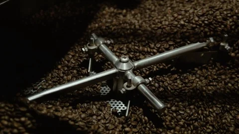 Roasted coffee beans are being mixed. the wheel is spinning Stock Footage 108064636