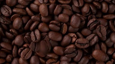 Roasted coffee beans are falling down, top view Stock Footage 231219395