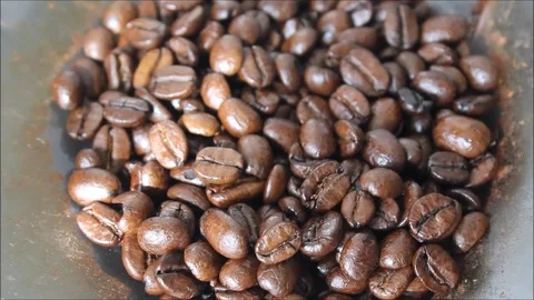Roasted coffee beans are ground in a coffee machine. Video stock 91914637