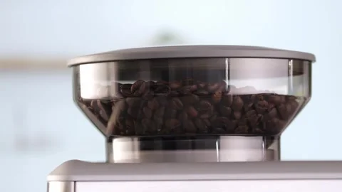 Roasted coffee beans are ground in a grinder of electric coffee machine. Drink a Video stock 278394464