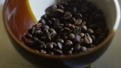 Roasted coffee beans are poured into the bowl Stock Footage 88435683