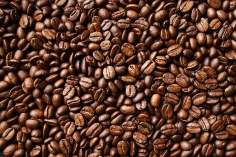 Roasted coffee beans background. Abstract texture pattern Stock Photos