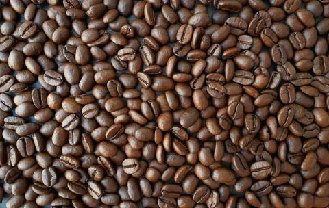 Roasted coffee beans background for beverage commercial ads use Stock Photos