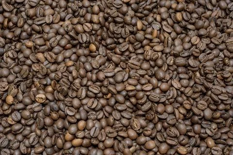 Roasted coffee beans background. Coffee beans saturated color picture beautif Stock Photos