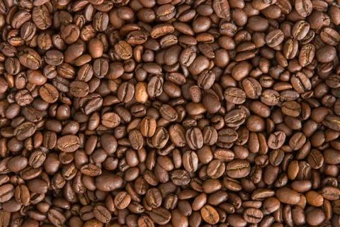 Roasted coffee beans background. Flat lay composition of coffee mood concept Stock Photos