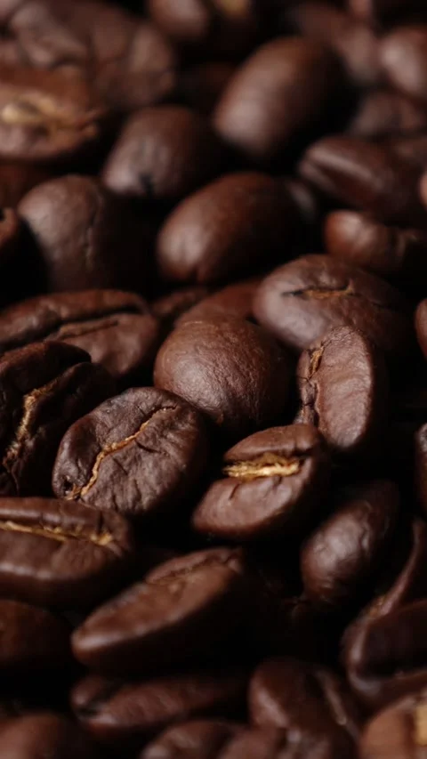 Roasted coffee beans background Video stock 276451898