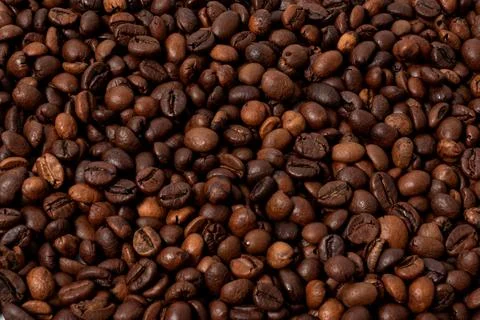 Roasted coffee beans as a background pattern Stock Photos