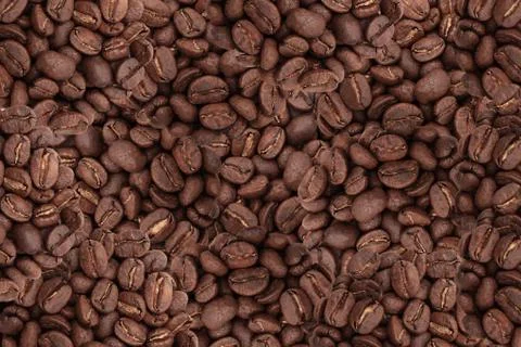Roasted coffee beans background. Stock Photos