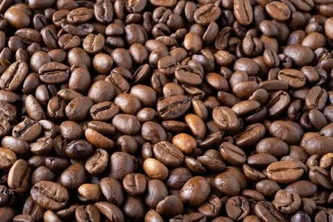Roasted coffee beans background. Stock Photos