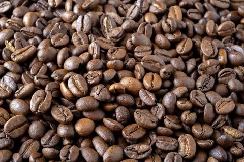 Roasted coffee beans background. Stock Photos