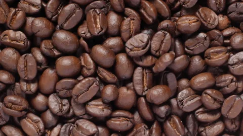 Roasted coffee beans background rotates Stock Footage 143610270