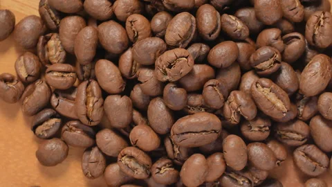 Roasted coffee beans background rotates Stock Footage 143657725