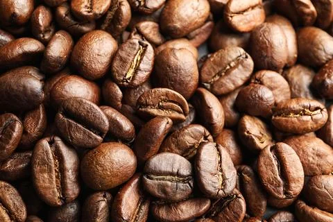 Roasted coffee beans as background, top view Stock Photos