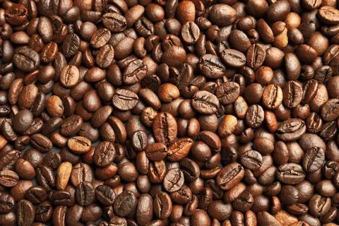 Roasted coffee beans as background, top view Stockfoto's