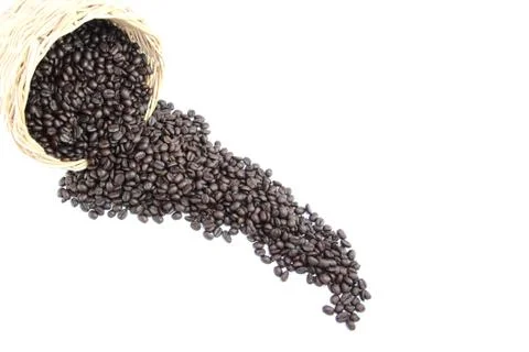 Roasted coffee beans in basket. Stock-Fotos
