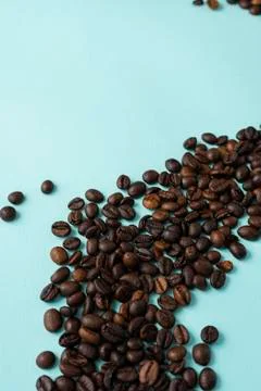Roasted coffee beans on a blue background Stock Photos