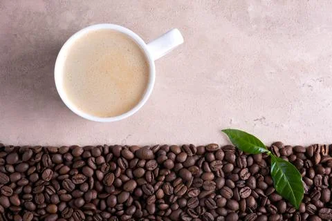 Roasted coffee beans border and cup of coffee Stock Photos