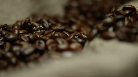 Roasted Coffee Beans on Burlap Texture Video stock 142071742
