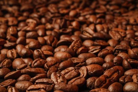 Roasted coffee beans, can be used as background. Coffee production concept fo Stock Photos