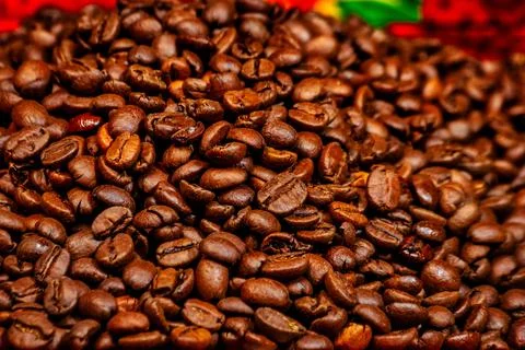 Roasted coffee beans on a ceramic plate Stock Photos