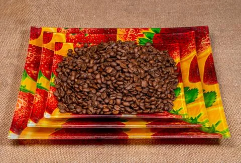 Roasted coffee beans on a ceramic rectangular plate Stock Photos
