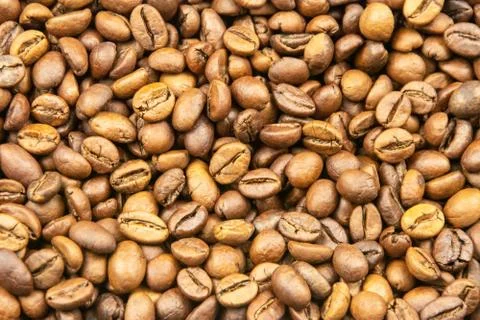 Roasted coffee beans close-up for background Stock Photos