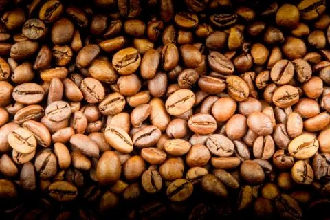 Roasted coffee beans close-up for background Stock Photos