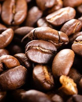 Roasted coffee beans close up. Background. Stock Photos