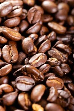 Roasted coffee beans close up. Background. Stock Photos