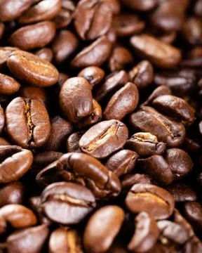 Roasted coffee beans close up. Background. Stock Photos
