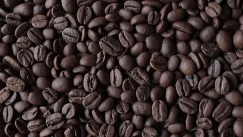 Roasted coffee beans close-up, rotating clockwise Stock Footage 136675698