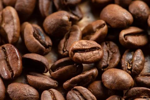 Roasted coffee beans. Close-up. Selective focus. Stock Photos