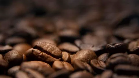 Roasted coffee beans close-up on a table Stock Photos