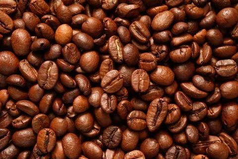 Roasted coffee beans close-up for use as a background texture. Photos