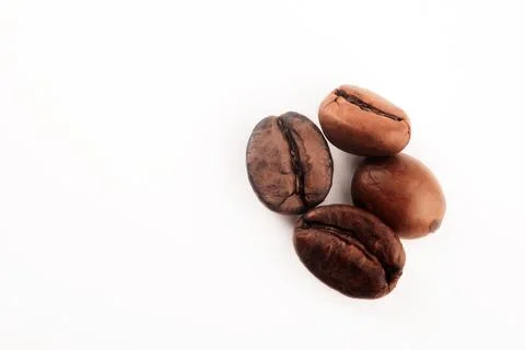 Roasted Coffee Beans Close Up on White Background Stock Photos