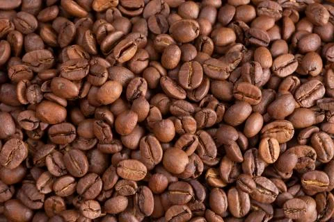 Roasted coffee beans closeup. background. Copy space Stock Photos