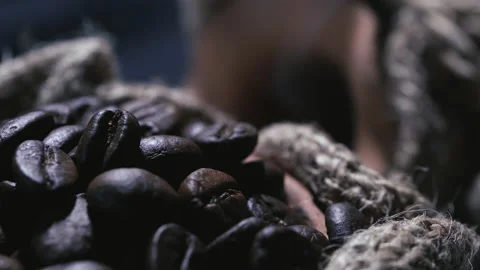 Roasted coffee beans in a cloth bag. Smoke from coffee roasting. Stock Footage 157316363