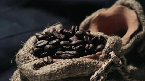 Roasted coffee beans in a cloth bag. Smoke from coffee roasting. Stock Footage 157758828