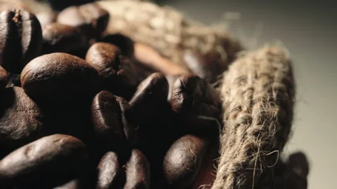 Roasted coffee beans in a cloth bag. Smoke from coffee roasting. Stock Footage 157759088