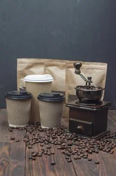 Roasted coffee beans in coffee grinder on Wooden Table 스톡 사진