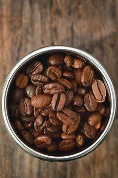 Roasted coffee beans in Coffee Machine Filter Stock Photos