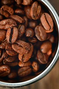 Roasted coffee beans in Coffee Machine Filter Stock Photos