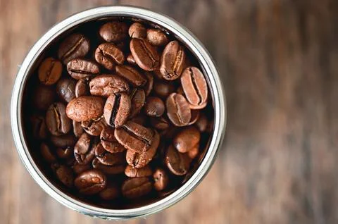 Roasted coffee beans in Coffee Machine Filter Stock Photos