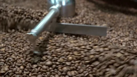 Roasted coffee beans in a coffee roaster Video stock 70425984