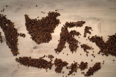 Roasted coffee beans concept for map of Indonesia  Stock Photos