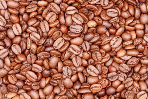 Roasted coffee beans creating natural brown texture background Stock Photos